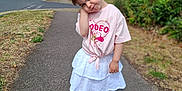 Violet joined the competition — help win amazing prizes! child, girl, sidewalk, street, tree, grass, house, cloud, sky, pink_tshirt, white_skirt, white_shoes, socks, pose, cute, outdoor, daylight, hair_tie, expression, residential_area