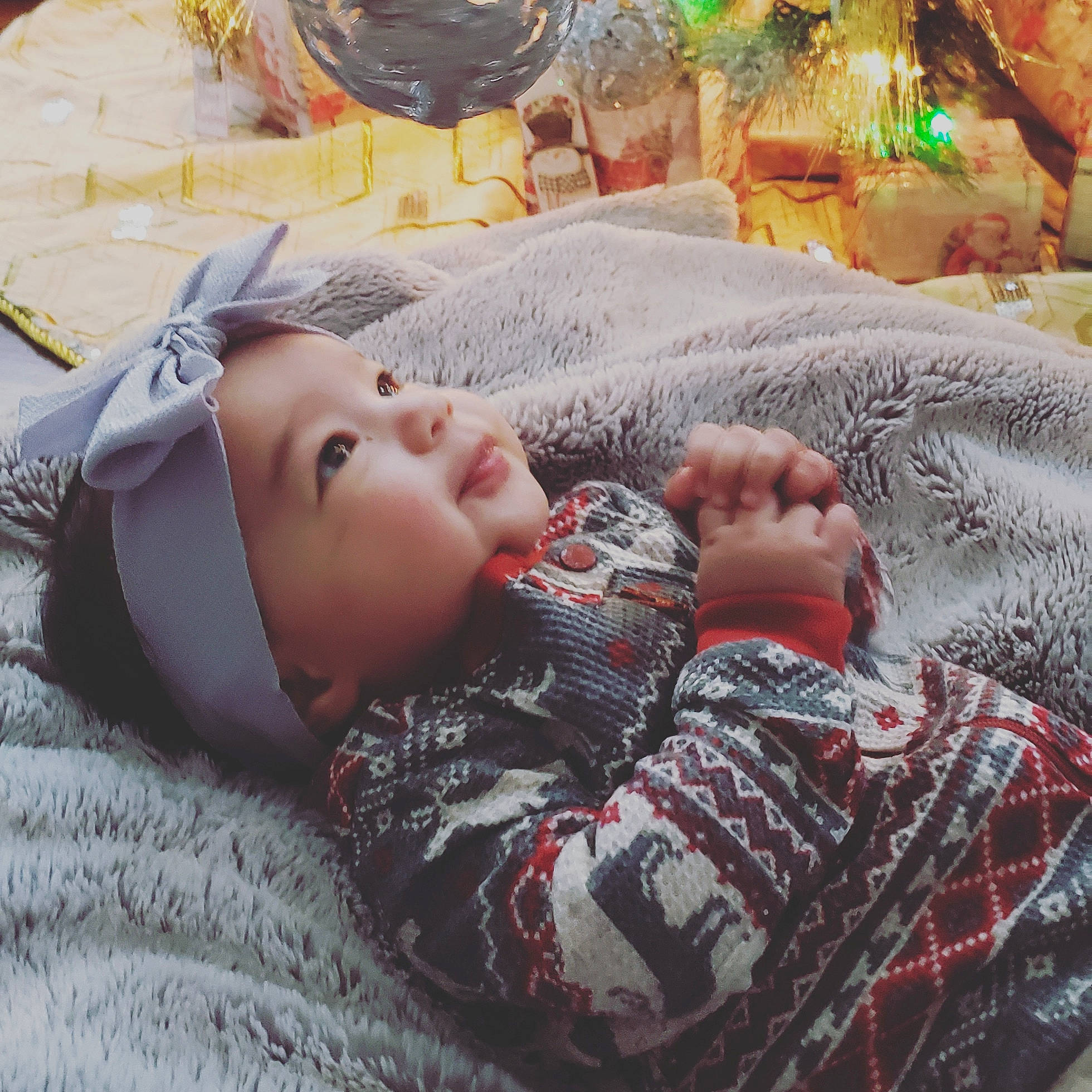 Araya is registered to the contest to win money with this photo: baby, bedding, bedtime, child, comfort, event, face, fur, grass, headwear, holiday, leisure, linens, nap, pattern, person, room, sitting, sleep, toddler