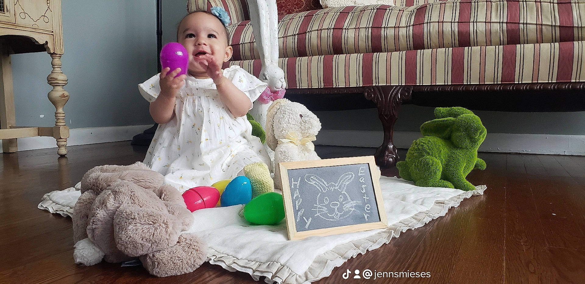 Araya is registered to the contest to win money with this photo: baby_toddler_clothing, child, comfort, couch, dress, face, furniture, green, happy, linens, pattern, person, pillow, pink, product, stuffed_toy, table, teddy_bear, textile, toddler