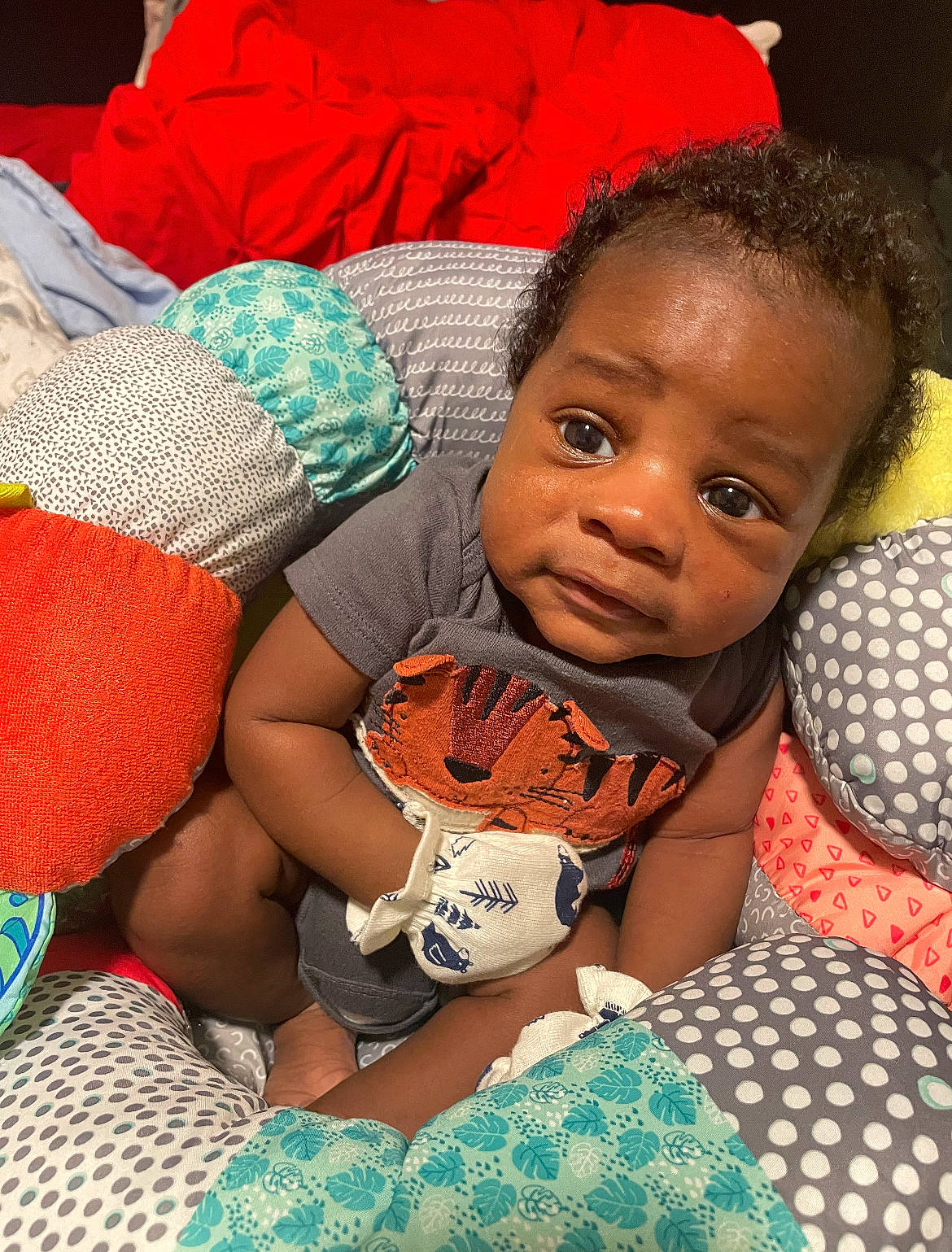 Jrue joined the competition — help win amazing prizes! arm, baby, baby_toddler_clothing, child, comfort, couch, facial_expression, finger, fun, happy, head, linens, pattern, person, product, room, sitting, skin, smile, thigh
