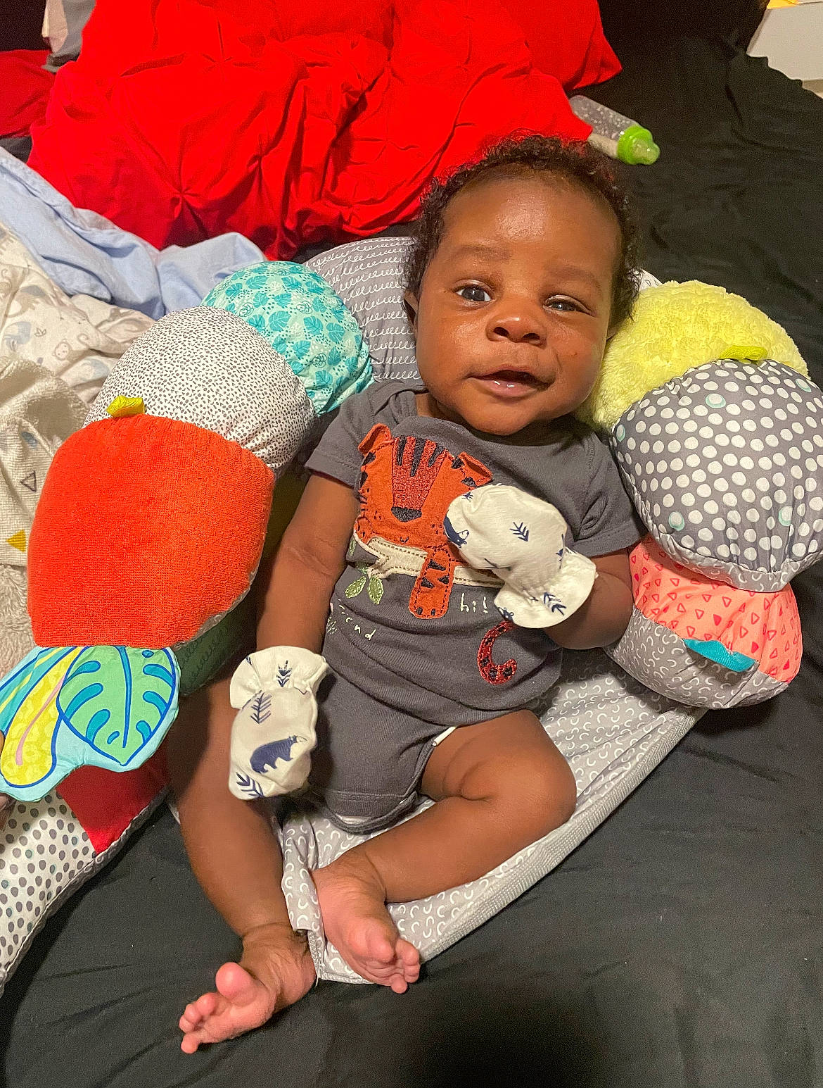 Jrue joined the competition — help win amazing prizes! arm, baby, baby_products, baby_toddler_clothing, child, comfort, eye, finger, fun, happy, human_body, human_leg, lap, leg, person, red, sitting, skin, t_shirt, thigh