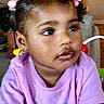 Lilly joined the competition — help win amazing prizes! toddler, child, girl, pink_bows, purple_shirt, indoor, portrait, face, curly_hair, earrings, furniture, couch, expression, young_child, casual_clothing, seated, looking_away, home, cute, curly_hair_buns