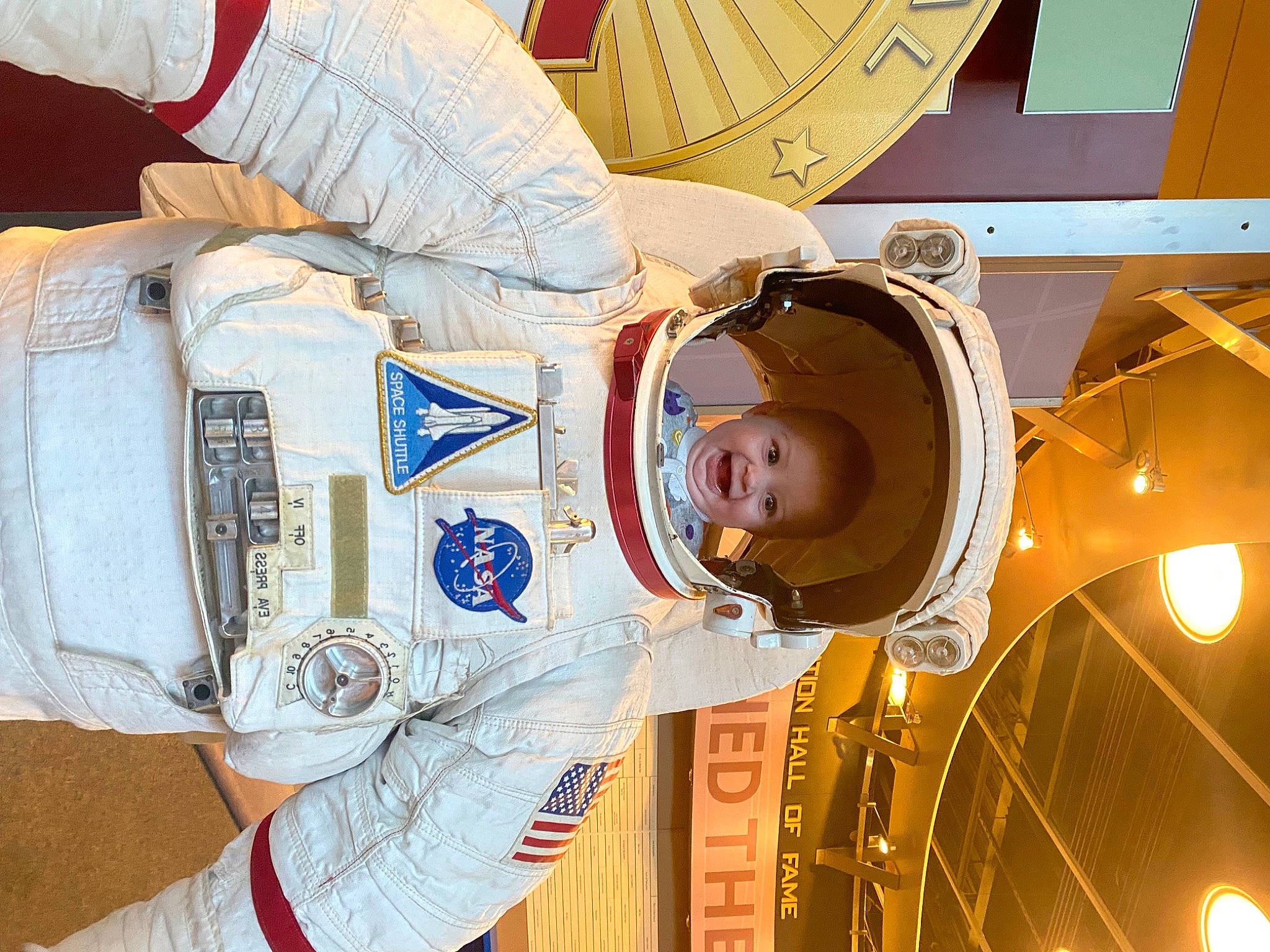 Karlee is registered to the contest to win money with this photo: aerospace_engineering, astronaut, baby, baby_toddler_clothing, child, circle, fun, hat, light, organ, person, sleeve, space, sun_hat, toddler, white, world
