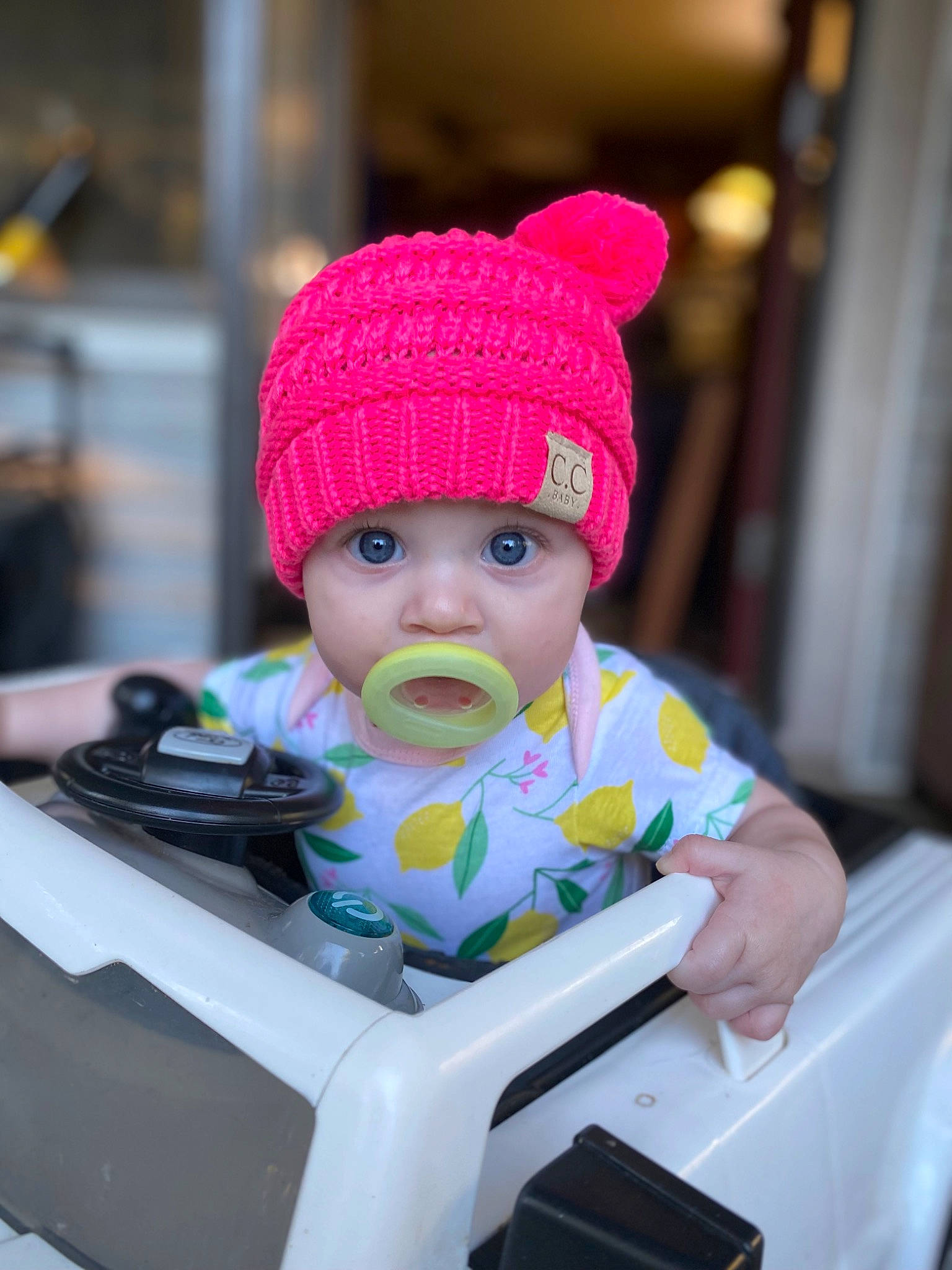 Karlee joined the competition — help win amazing prizes! art, baby, baby_toddler_clothing, beanie, cap, child, desk, fashion_accessory, fun, gadget, headgear, headwear, knit_cap, magenta, outerwear, person, personal_protective_equipment, purple, sitting, toddler