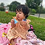 Zylah is registered to the contest to win money with this photo: toddler, child, outdoor, grass, blanket, toy, person, curly_hair, doll, pink, dress, nature, playing, cute, sitting, young_child, daylight, greenery, focus, exploring