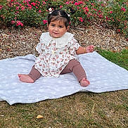 Sidak joined the competition — help win amazing prizes! baby, child, girl, outdoor, grass, flowers, blanket, pigtails, smile, garden, nature, plants, house, fence, greenery, cute, sitting, clothing, portrait, daylight