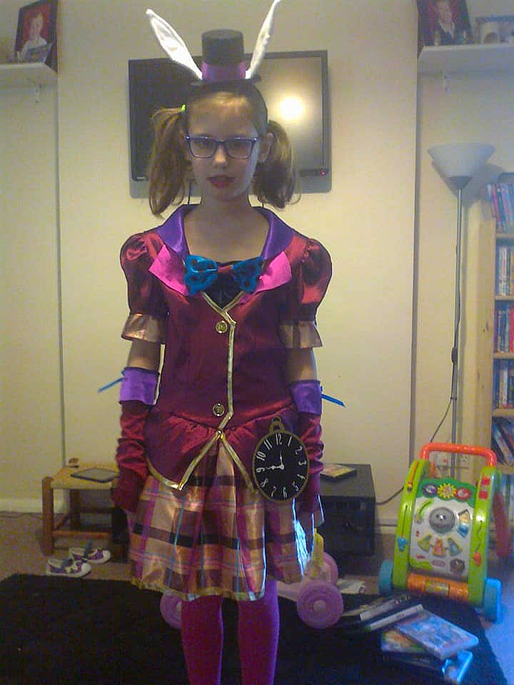 Ciara is registered to the contest to win money with this photo: clothing, costume, design, fashion_design, magenta, pattern, person, plaid, purple, tartan, textile