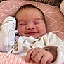 Arabella Rose joined the competition — help win amazing prizes! baby, smiling, infant, blanket, cushion, white_clothing, face, hand, resting, cozy, pink, soft_texture, sleepy, cute, newborn, portrait, indoors, comfort, child, peaceful