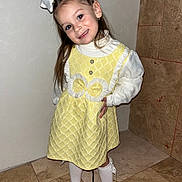 Summer a rejoint le concours — aidez-le/la à gagner de superbes lots ! child, girl, yellow_dress, white_bow, smile, happy, posing, tiled_floor, wall, indoor, fashion, cute, young, portrait, feet, stockings, earrings, long_hair, playful, standing