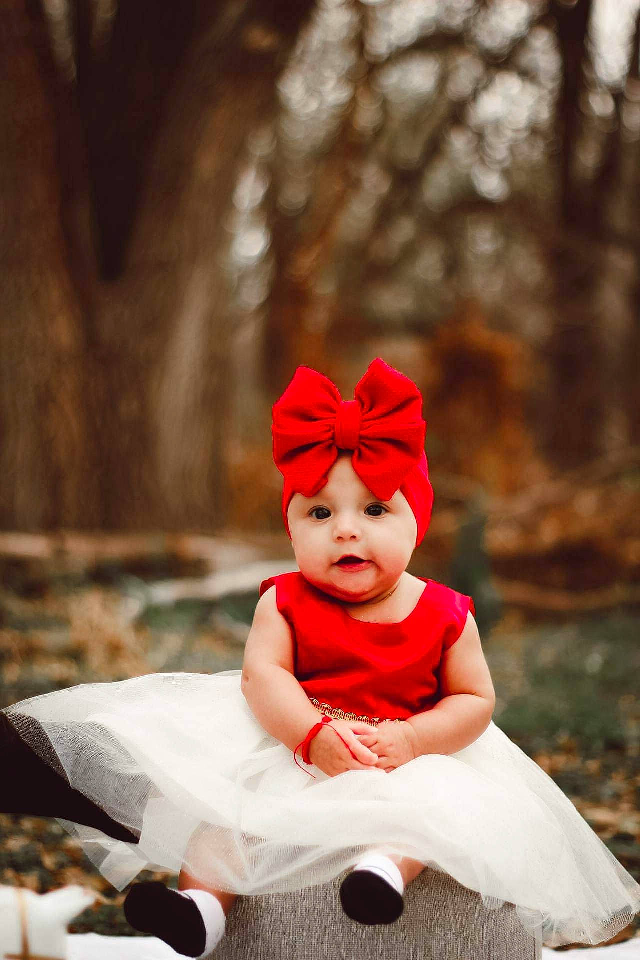 Melanie joined the competition — help win amazing prizes! baby, baby_toddler_clothing, cap, carmine, child, costume_hat, event, fictional_character, flash_photography, fun, fur, grass, happy, hat, headgear, headwear, person, plant, sitting, toddler