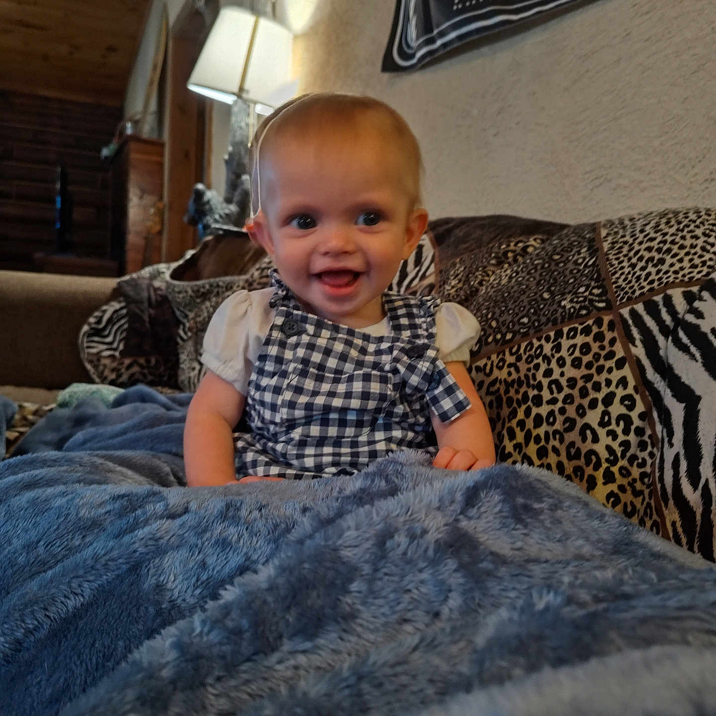 Hope is registered to the contest to win money with this photo: adult, baby, bed, blanket, clothing, couch, cushion, face, furniture, happy, head, homedecor, male, man, pants, person, photography, portrait, sitting, smile