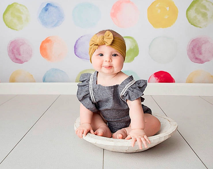 Ava is registered to the contest to win money with this photo: baby, baby_toddler_clothing, child, child_model, daughter, pattern, person, pink, play, potty_training, room, sitting, toddler