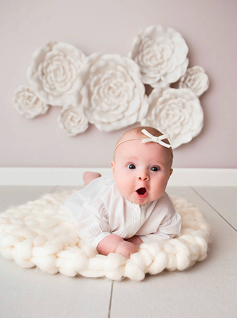 Ava joined the competition — help win amazing prizes! baby, baby_bloomers, baby_toddler_clothing, beanie, child, costume_accessory, crochet, fashion_accessory, fur, hair_accessory, headband, headgear, headpiece, person, pink, room, surprise, toddler, white
