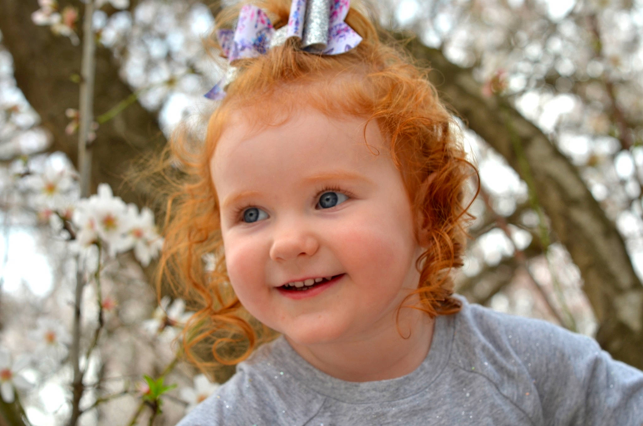 Bryer is registered to the contest to win money with this photo: baby, branch, child, child_model, ear, hair, happy, joy, person, portrait_photography, shortstraw_pine, smile, toddler, tree