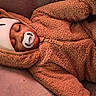 baby, sleeping, pacifier, hat, onesie, fuzzy_clothing, infant, child, face, cozy, warm, resting, portrait, indoor, cute, peaceful, soft_texture, headwear, zipped_jacket, relaxation
