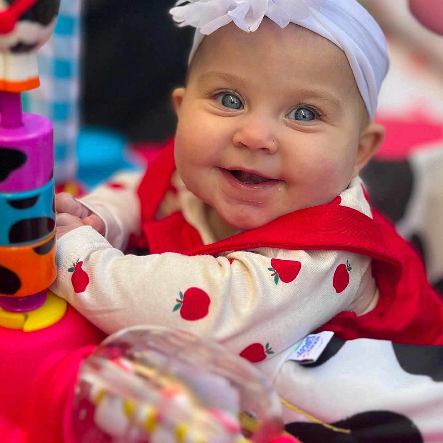 Sophia joined the competition — help win amazing prizes! baby, babylaughing, clothing, coat, dress, face, food, fruit, happy, hat, head, jacket, laughing, pear, person, photography, plant, portrait, produce, smile