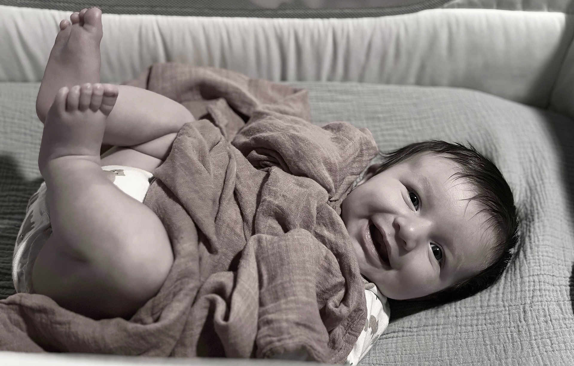 Baker joined the competition — help win amazing prizes! baby, infant, smile, blanket, diaper, legs, feet, face, happy, cute, lying_down, indoors, soft_texture, monochrome, portrait, child, cozy, playful, expression, young