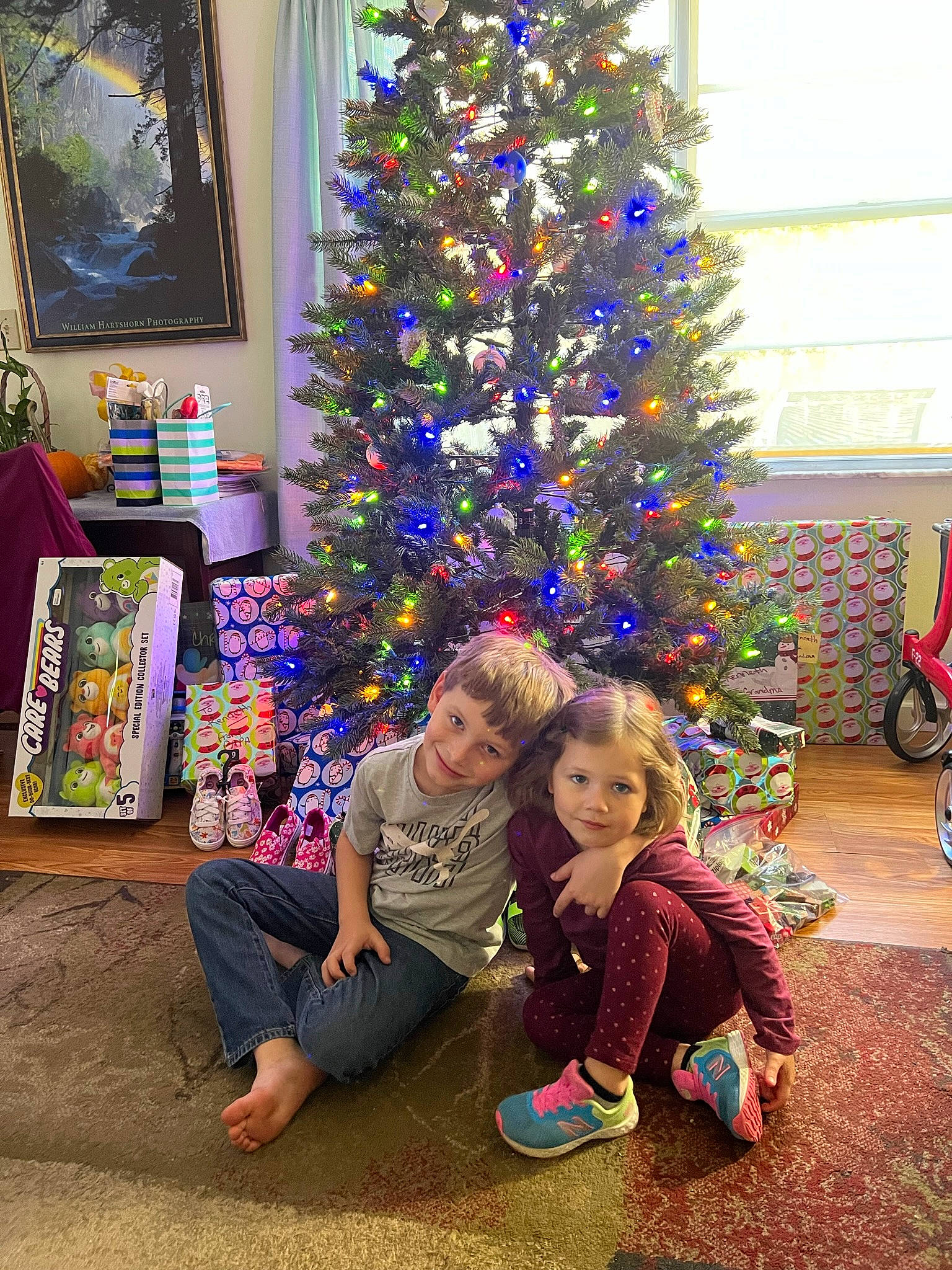 Selina is registered to the contest to win money with this photo: christmas, christmas_decoration, christmas_eve, christmas_ornament, christmas_tree, event, evergreen, fun, happy, holiday, holiday_ornament, joy, lap, person, picture_frame, plant, purple, tire, toddler, tree