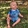 toddler, child, grass, outdoor, blue_overalls, barefoot, smiling, sunlight, fence, tree, nature, daylight, baby, cute, happy, summer, portrait, sitting, clothing, playful