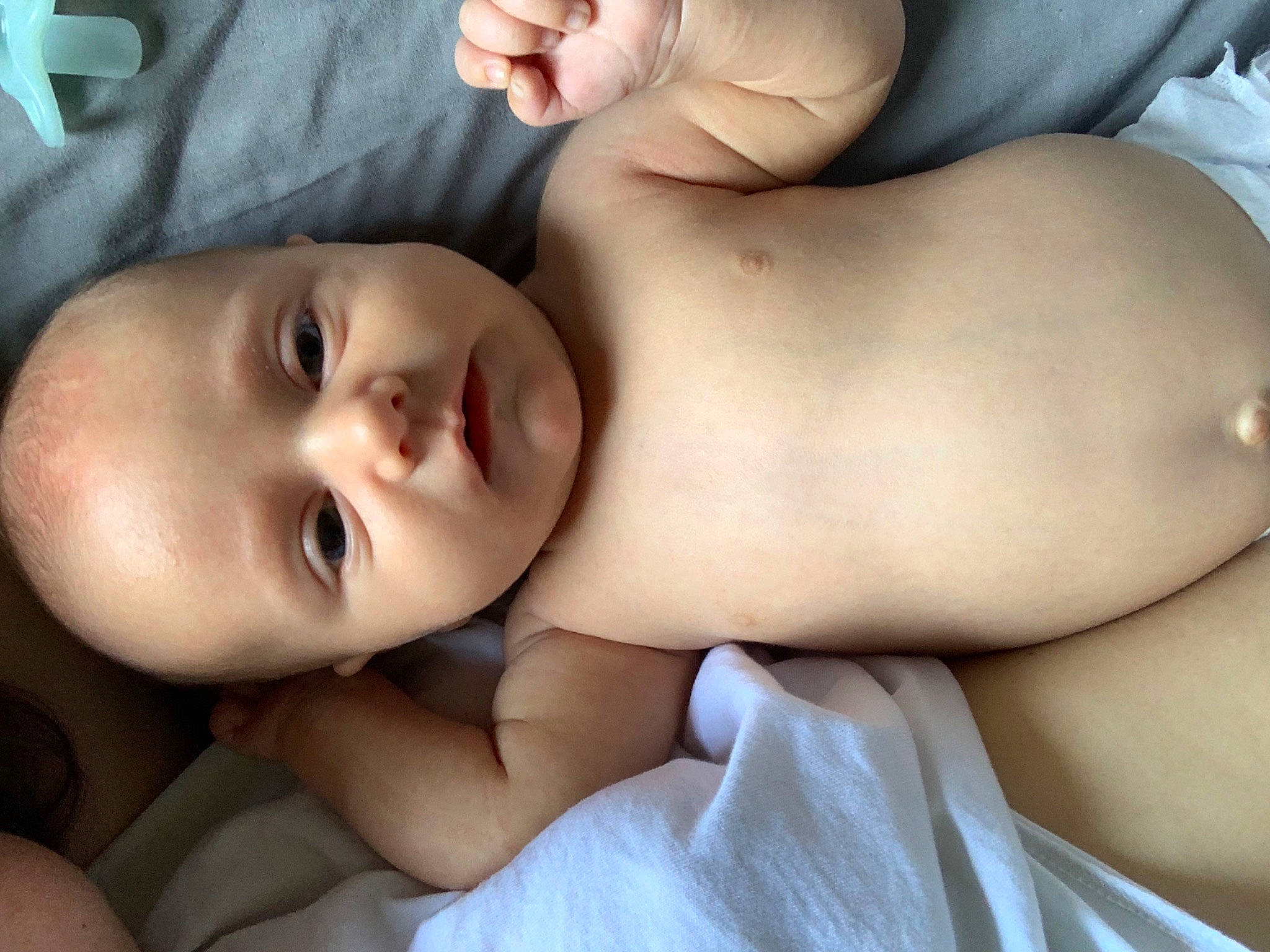 Bear is registered to the contest to win money with this photo: abdomen, baby, cheek, chest, comfort, eye, eyelash, finger, flash_photography, gesture, human_body, lip, mouth, muscle, nose, people, person, skin, stomach, toddler