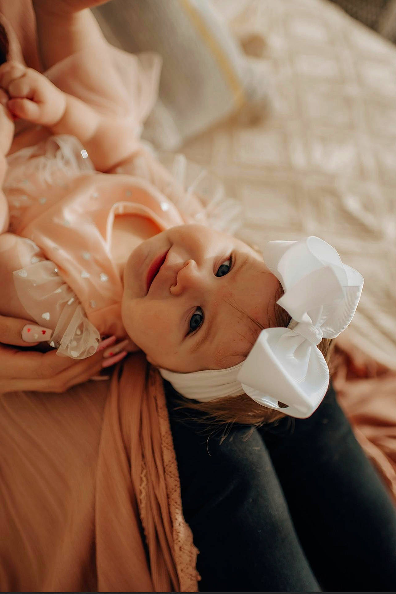 Everleigh is registered to the contest to win money with this photo: baby, child, comfort, event, flash_photography, fun, fur, gesture, hairstyle, happy, headwear, peach, person, photo_shoot, portrait_photography, room, shoulder, sitting, skin, toddler