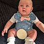 baby, infant, denim_overalls, minnie_mouse, pink_bow, white_socks, frilly_socks, milestone_sign, five_months, blue_eyes, chubby_cheeks, sitting, black_blanket, cute, portrait, child, indoor, soft_lighting, happy, clothing