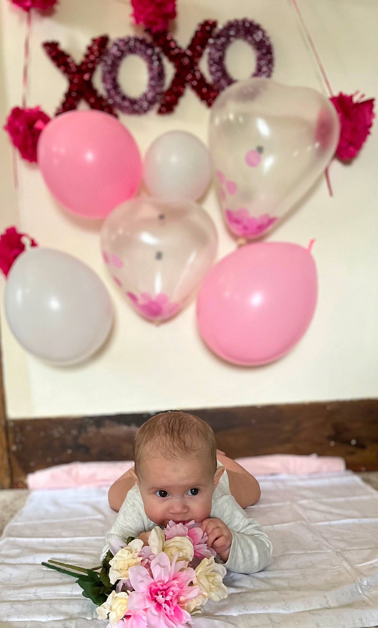 Raelynn is registered to the contest to win money with this photo: baby, balloon, chair, child, comfort, event, fashion_accessory, flower, flower_arranging, happy, magenta, party_supply, person, petal, pink, sweetness, tableware, textile, toddler, wedding_ceremony_supply