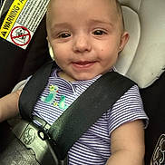 Cambrie joined the competition — help win amazing prizes! baby, child, car_seat, safety_harness, smile, face, infant, striped_shirt, embroidery, seatbelt, cute, happy, closeup, indoors, person, young_child, seat, car, child_safety, baby_clothing