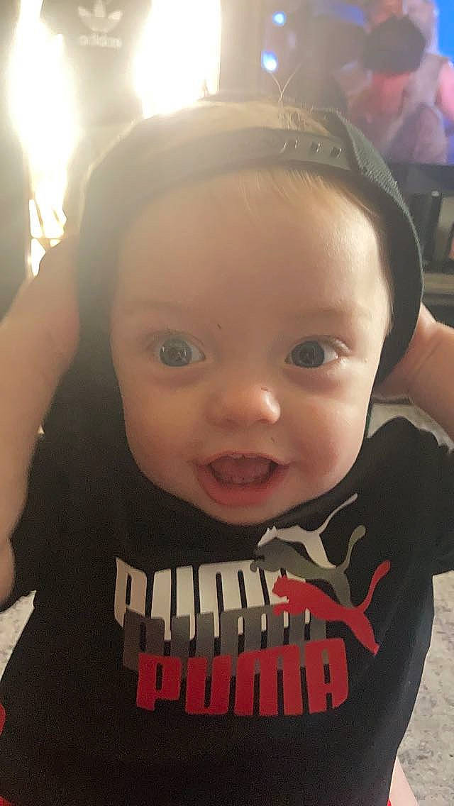 Kashton is registered to the contest to win money with this photo: baby, baby_toddler_clothing, black, cheek, chin, ear, eyebrow, eyelash, facial_expression, forehead, hairstyle, happy, iris, lip, mouth, nose, organ, person, skin, sleeve