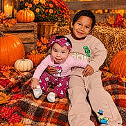 Reyna joined the competition — help win amazing prizes! children, baby, toddler, siblings, portrait, smiling, sitting, autumn, fall, pumpkins, lantern, flowers, chrysanthemums, hay_bale, leaves, blanket, outdoor, harvest, colorful, family