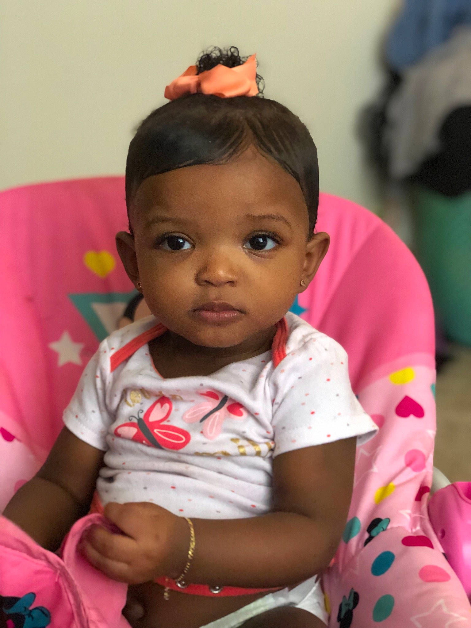 Melani joined the competition — help win amazing prizes! baby, black_hair, cheek, child, daughter, ear, face, forehead, head, lip, person, pink, sitting, skin, smile, toddler