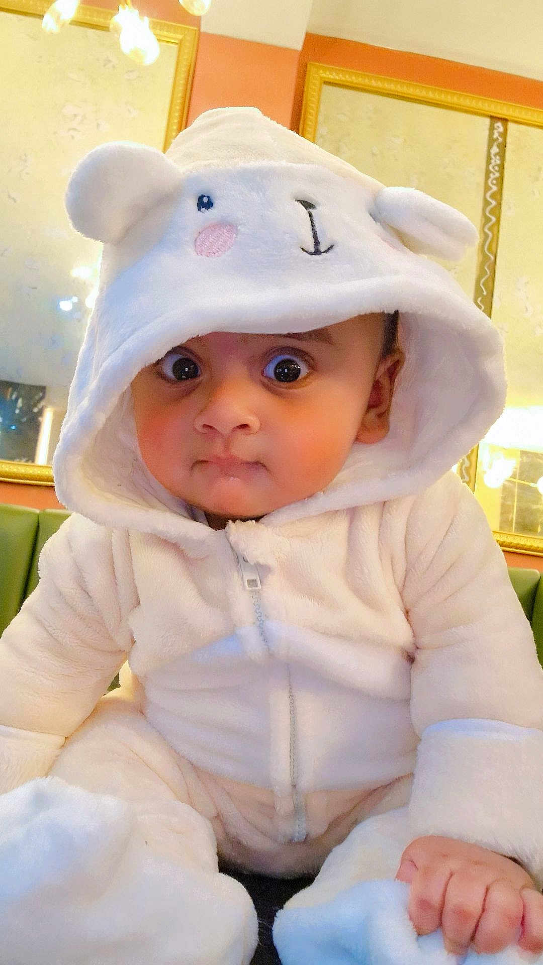 Mohammed Abaan joined the competition — help win amazing prizes! baby, child, cozy, curious, cute, cute_outfit, expression, face, hand, hoodie, indoor, infant, mirror, portrait, reflection, sitting, soft_texture, warm_lighting, white_clothing, wide_eyes