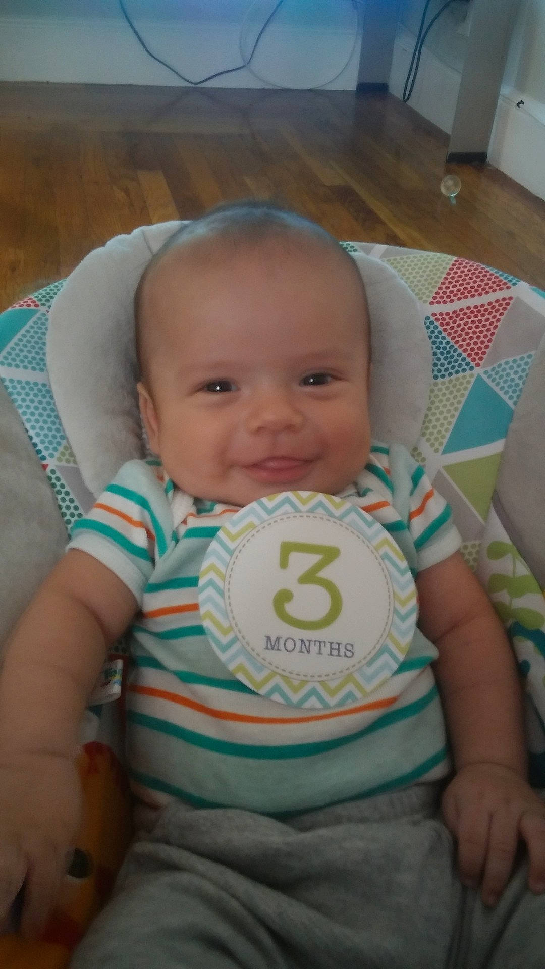 Emanuel is registered to the contest to win money with this photo: baby_products, bedtime, cheek, child, day, eye, face, finger, forehead, green, head, infant, iris, mouth, nose, person, product, sitting, skin, smile