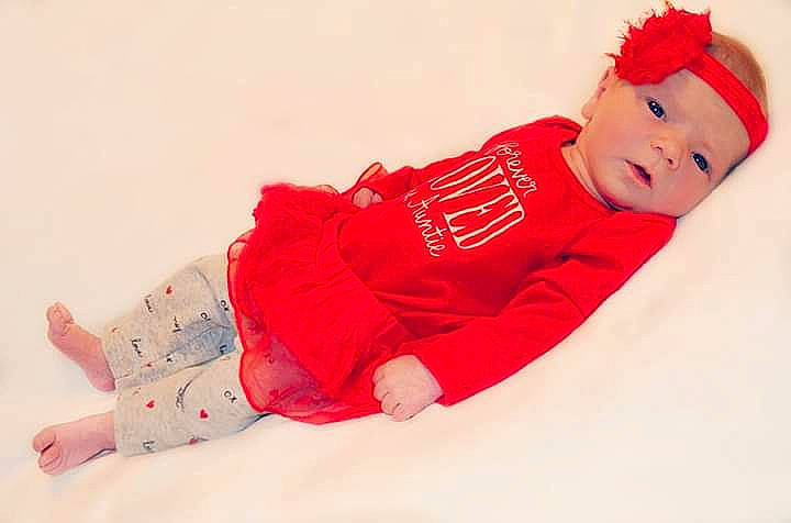 Kyndall joined the competition — help win amazing prizes! baby, baby_toddler_clothing, child, headwear, pajamas, person, pink, red, sleeve, toddler