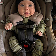 Santiago is registered to the contest to win money with this photo: baby, beanie, car_seat, child, clothing, cushion, cute, face, hands, harness, indoor, infant, knitwear, legs, person, safety, seat, smile, straps, young_child