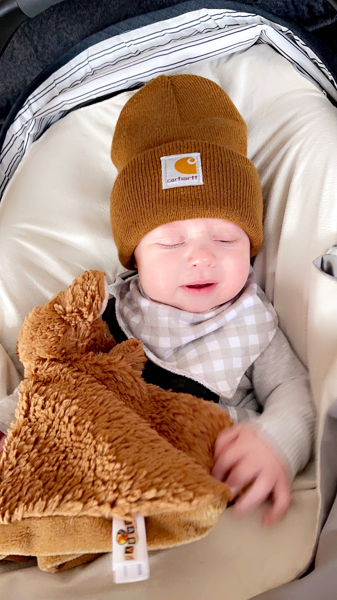 Emmerson is registered to the contest to win money with this photo: baby, baby_toddler_clothing, beanie, cap, cheek, child, collar, comfort, face, facial_expression, fashion_accessory, headwear, knit_cap, pattern, person, sitting, skin, sleeve, textile, toddler