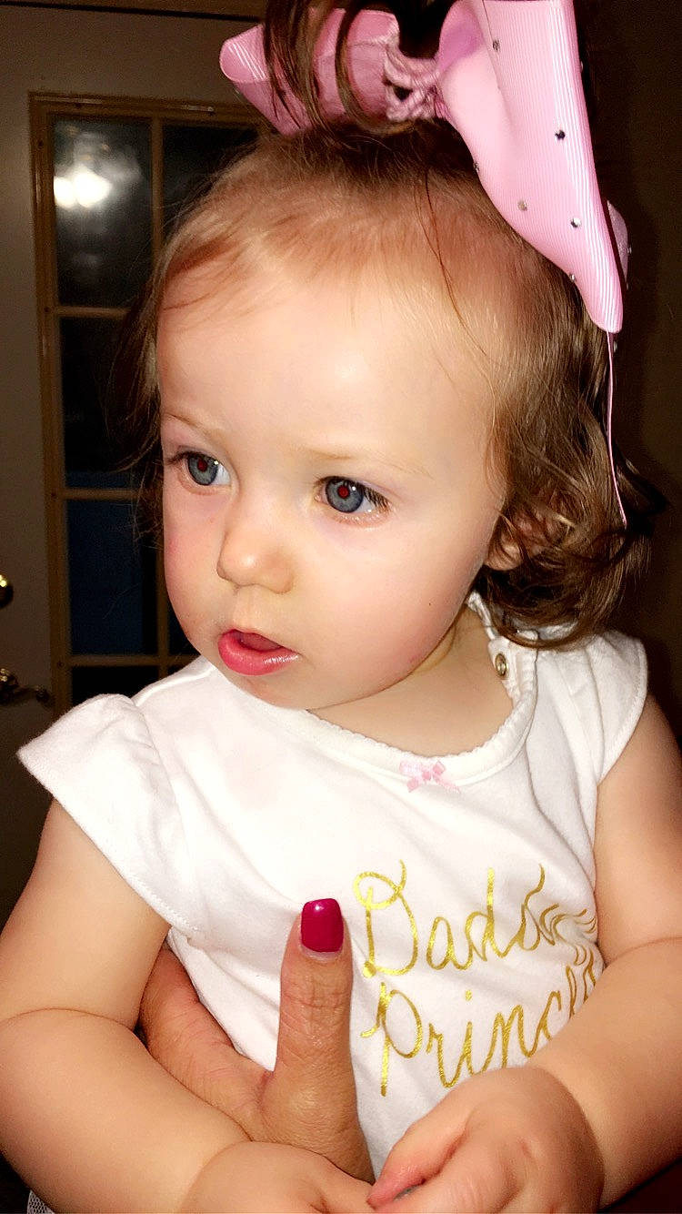 Kathryn is registered to the contest to win money with this photo: baby, beauty, brown_hair, cheek, child, child_model, ear, eye, face, hair, hair_accessory, lip, person, pink, skin, toddler
