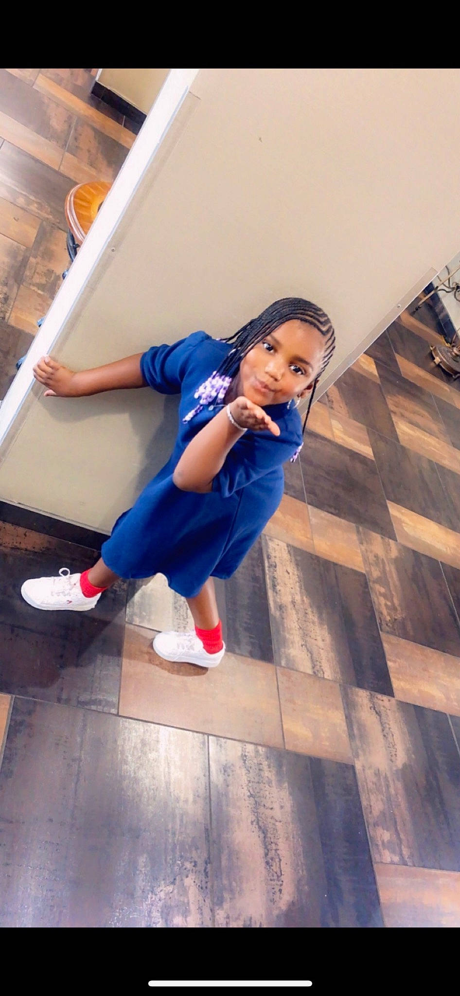 Prosper is registered to the contest to win money with this photo: elbow, electric_blue, fashion_design, floor, flooring, footwear, fun, happy, human_leg, knee, leg, leisure, person, shoe, sneakers, sportswear, stairs, thigh, toddler, waist