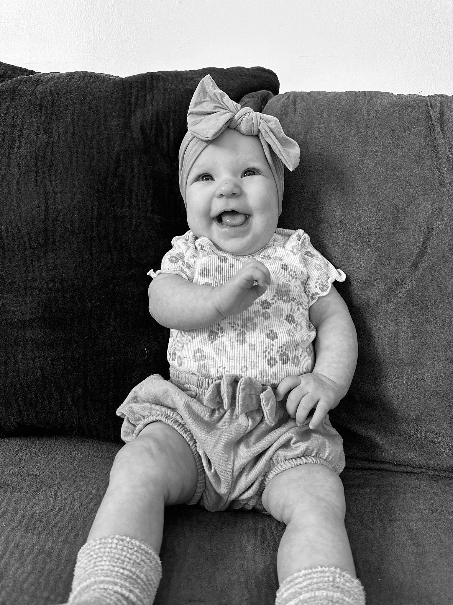 Oaklee joined the competition — help win amazing prizes! art, baby, baby_toddler_clothing, black, black_and_white, comfort, couch, eye, flash_photography, happy, head, headwear, knee, monochrome, monochrome_photography, person, sitting, sleeve, smile, style