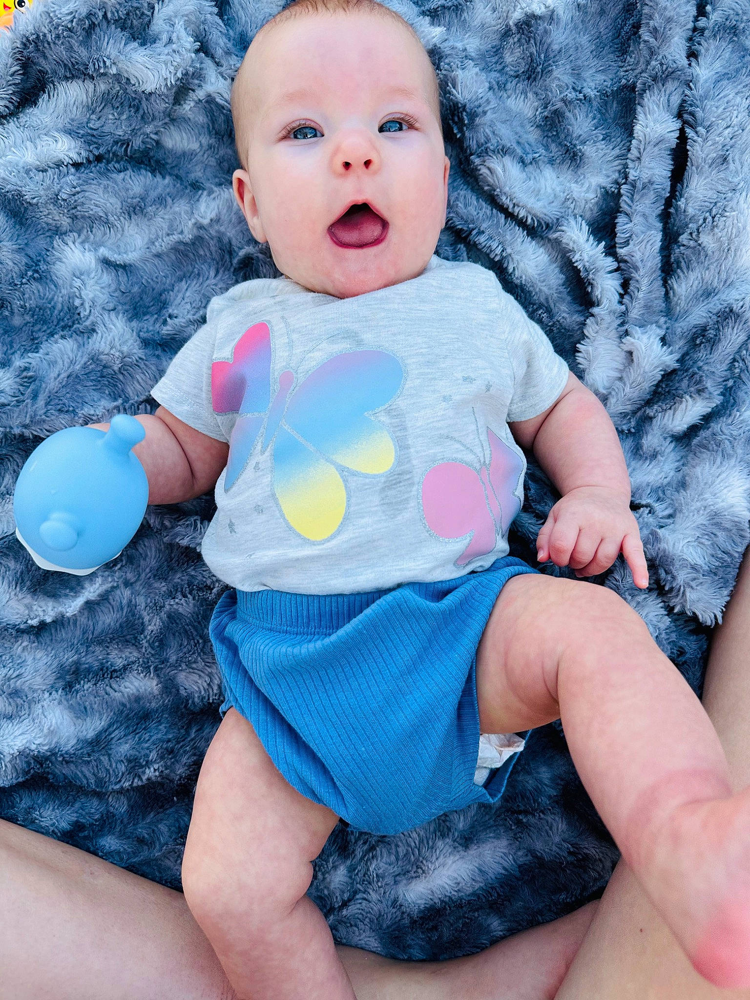 Oaklee is registered to the contest to win money with this photo: arm, azure, baby, baby_toddler_clothing, cool, eye, finger, hand, happy, head, leg, organ, person, pink, purple, skin, sleeve, surprise, t_shirt, textile