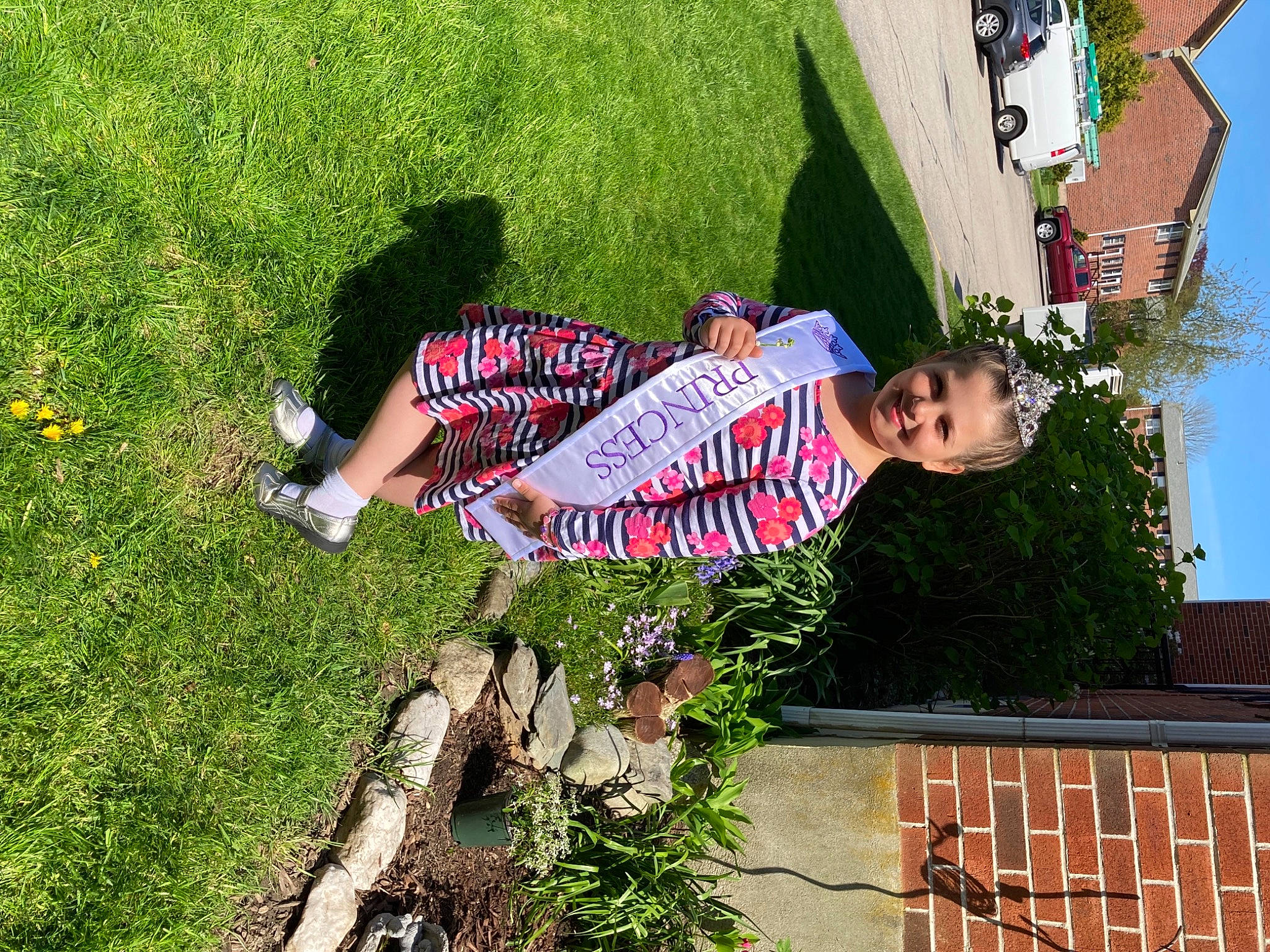 Sophia joined the competition — help win amazing prizes! fun, garden, grass, green, happy, human_leg, joy, landscape, leaf, leisure, people_in_nature, person, plant, recreation, roof, sandal, sitting, thigh, travel, tree