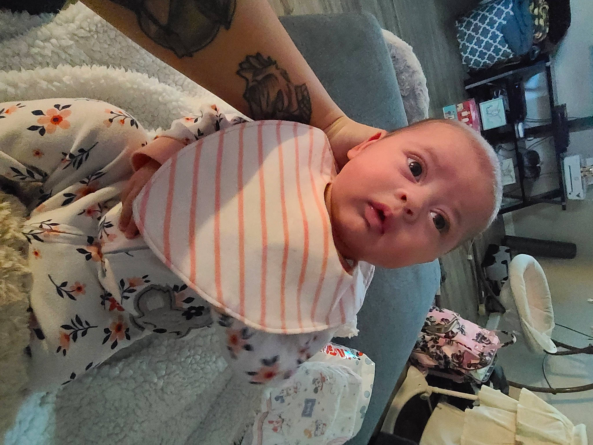 Eleanor is registered to the contest to win money with this photo: abdomen, audio_equipment, baby, baby_products, chair, child, comfort, flesh, fun, hairstyle, happy, human_leg, linens, pattern, person, room, sitting, thigh, toddler, toy