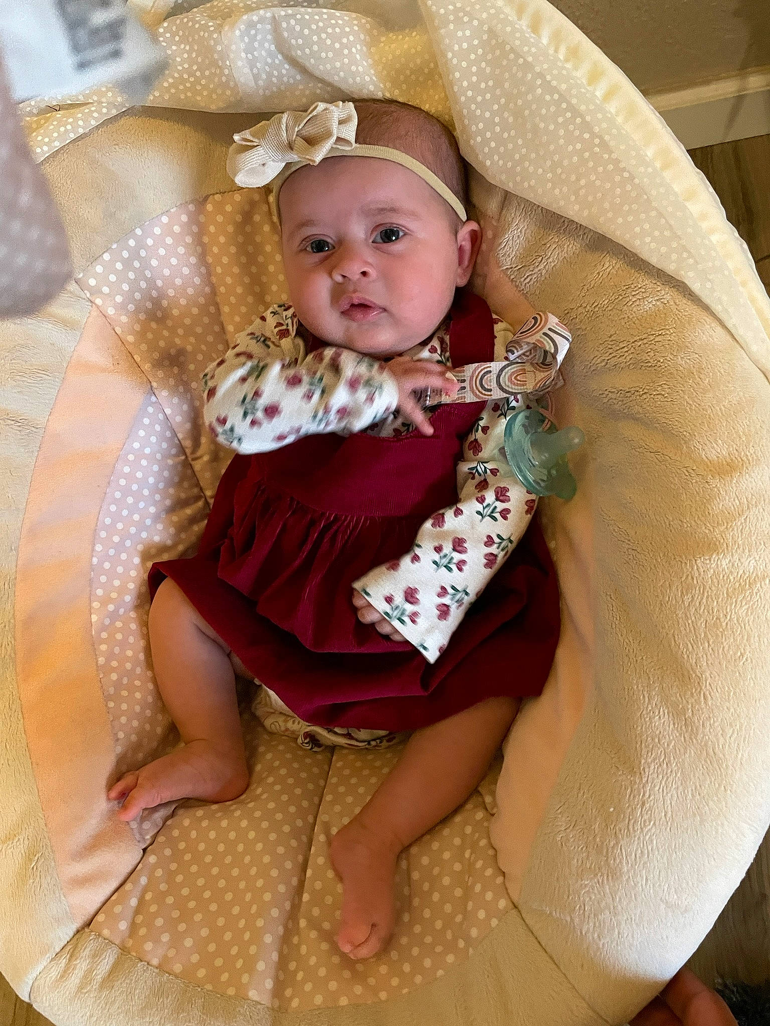 Eleanor is registered to the contest to win money with this photo: baby, baby_products, baby_safety, baby_toddler_clothing, chair, cheek, child, circle, comfort, eye, fashion_accessory, headwear, jewellery, lap, linens, person, pink, sitting, skin, textile