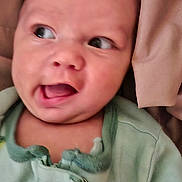 Malachi joined the competition — help win amazing prizes! baby, infant, face, clothing, green_onesie, bird_print, blanket, expression, mouth_open, eyes, head, skin, newborn, cute, child, portrait, indoors, soft, warm, babywear