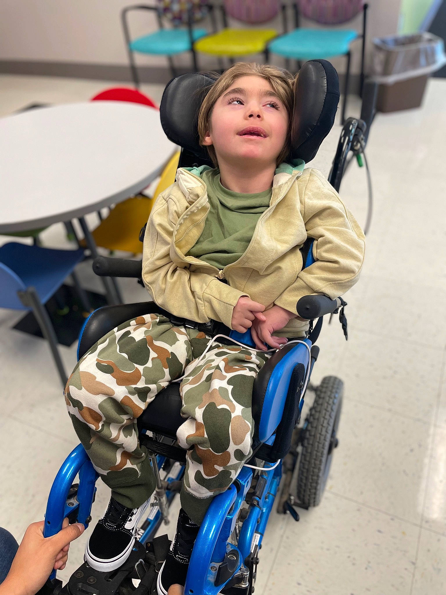 Zaylen is registered to the contest to win money with this photo: baby_products, bicycle_accessory, bicycle_tire, chair, child, electric_blue, face, fun, furniture, head, helmet, motor_vehicle, person, personal_protective_equipment, recreation, sitting, table, tire, toddler, wheel