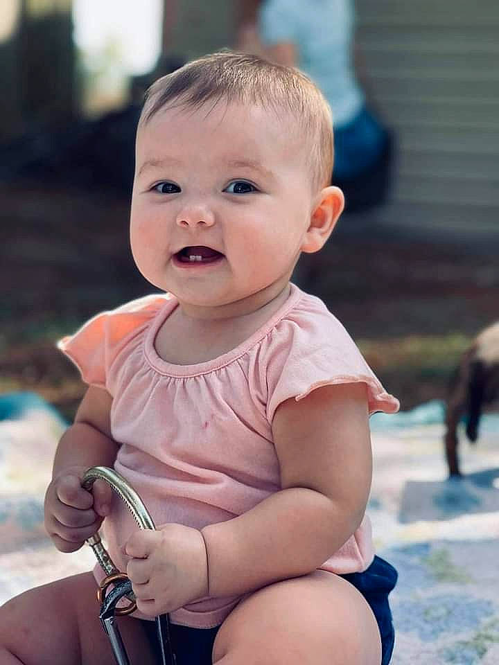 Echo is registered to the contest to win money with this photo: arm, baby, baby_toddler_clothing, cheek, eye, face, finger, hand, happy, head, iris, joint, lip, muscle, nose, person, pink, skin, smile, standing