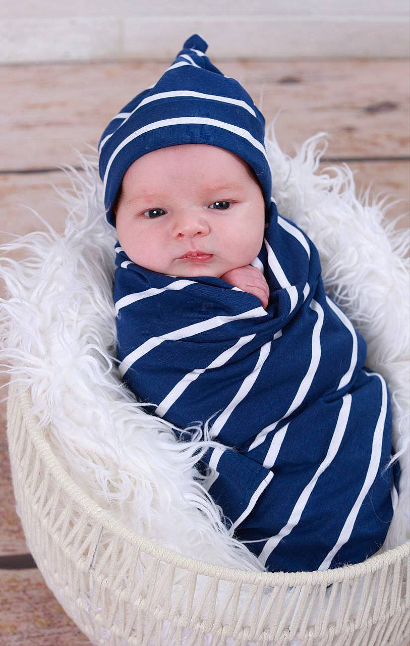 Koa is registered to the contest to win money with this photo: azure, baby, baby_toddler_clothing, cap, child, clothing, costume_hat, electric_blue, eye, fashion_accessory, fur, grass, happy, headgear, headwear, outerwear, pattern, person, sleeve, toddler