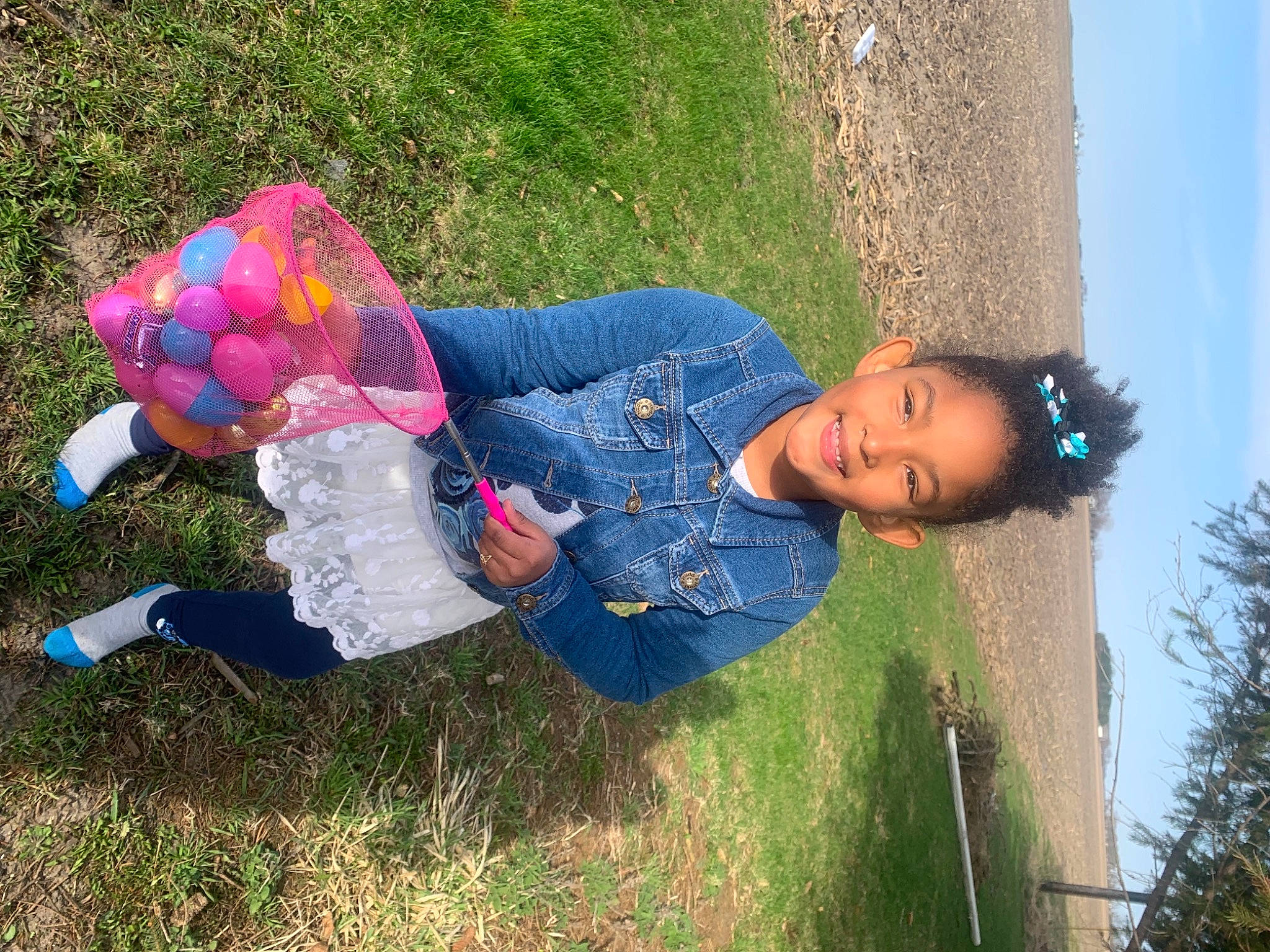 Aryana joined the competition — help win amazing prizes! baby_toddler_clothing, child, denim, electric_blue, fun, grass, grassland, happy, joy, leisure, magenta, pattern, people_in_nature, person, plant, play, recreation, sitting, sky, toddler