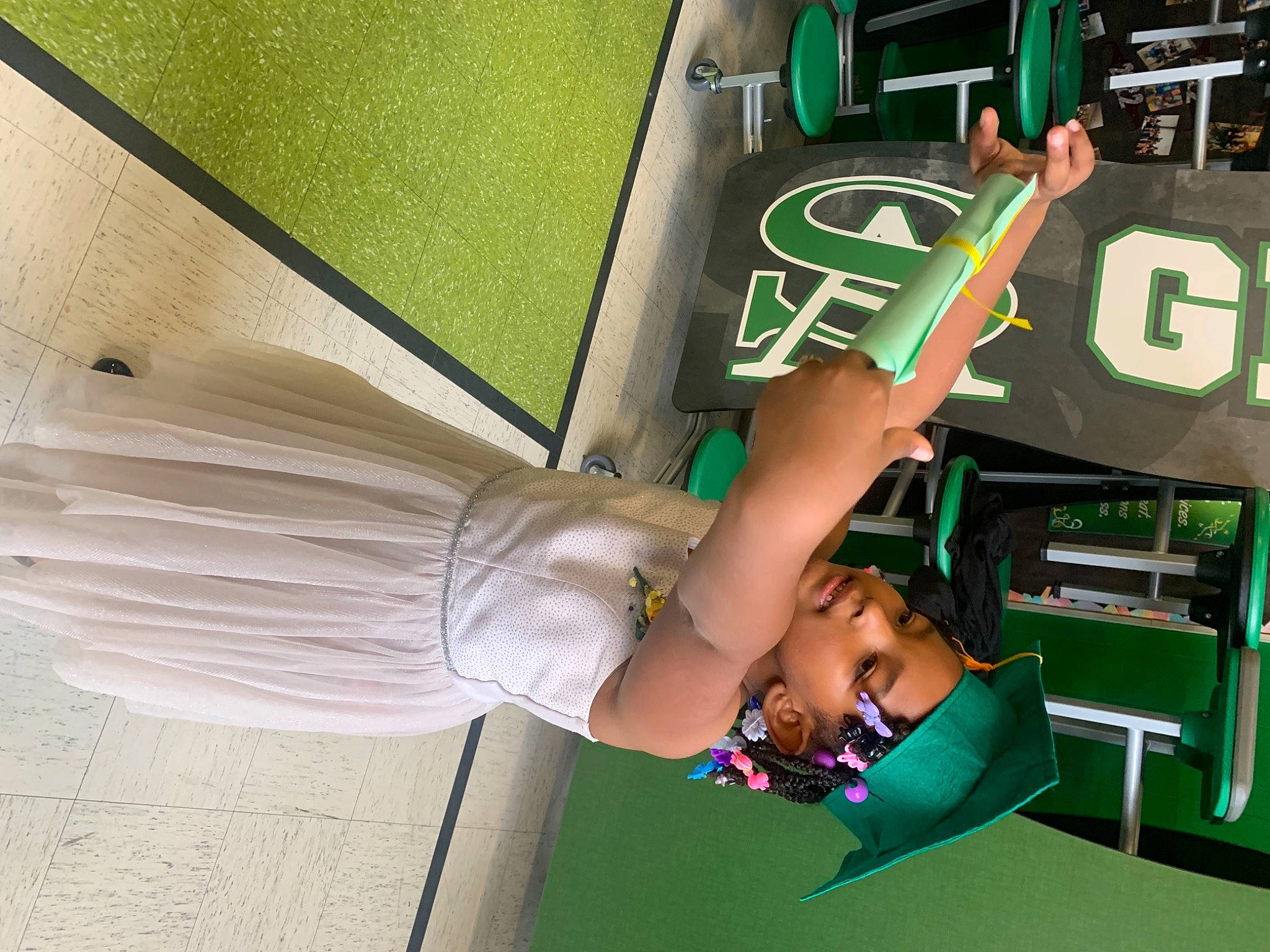 Aryana joined the competition — help win amazing prizes! automotive_exterior, bumper, elbow, event, fashion_accessory, fashion_design, fun, green, headwear, human_leg, joint, leisure, logo, machine, motor_vehicle, person, room, t_shirt, thigh, umbrella