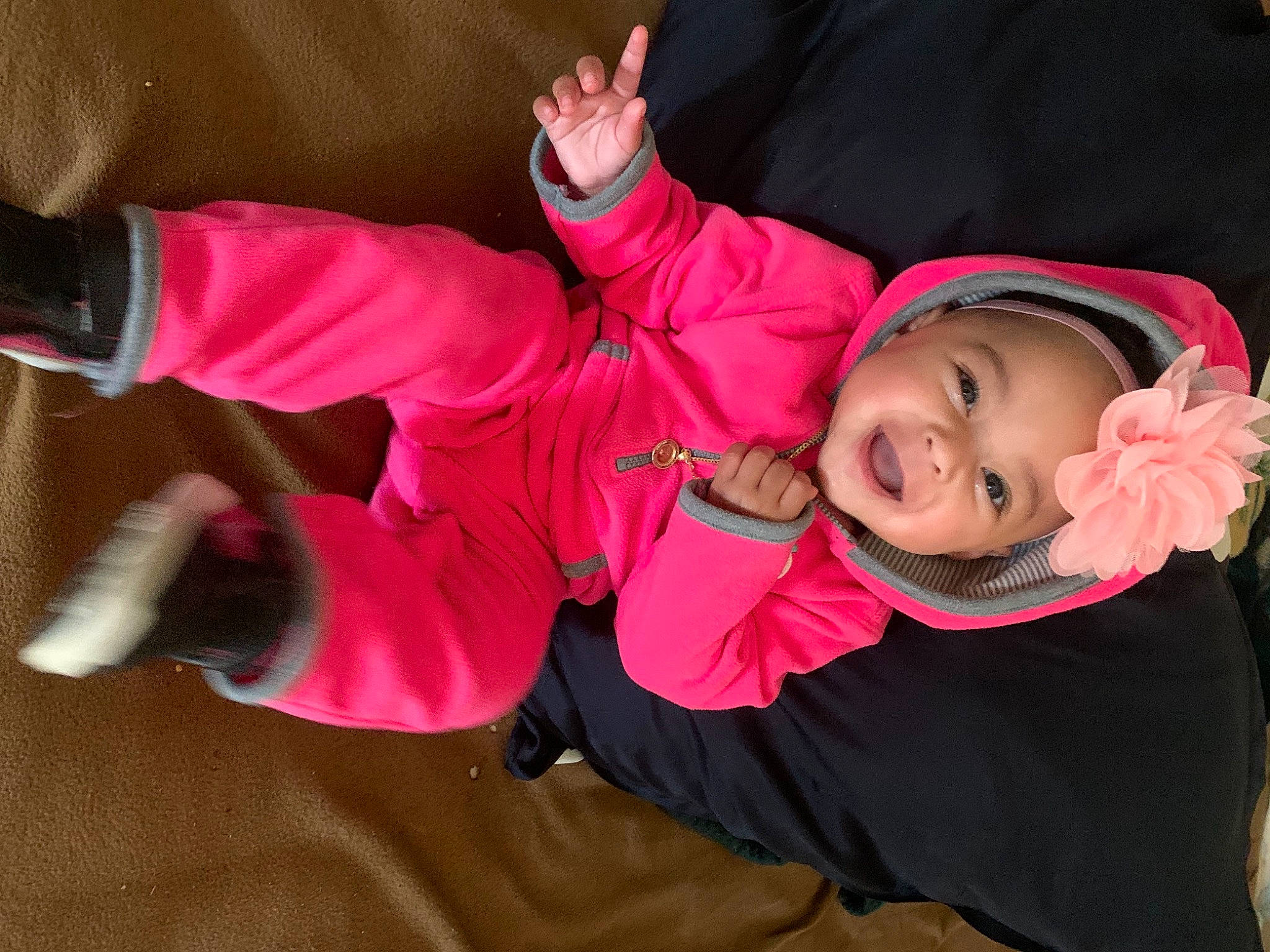 Jordyn joined the competition — help win amazing prizes! baby, baby_toddler_clothing, child, comfort, costume, event, fun, glove, headwear, knee, lap, leisure, magenta, mouth, person, pink, room, smile, sock, thigh